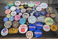 Full overhead view of all pinback buttons laid out