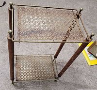 Angled top view showing glass-topped lattice upper shelf and lower lattice shelf