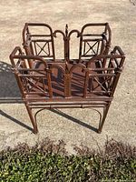 Front angled view of wrought iron rack showing decorative arches and lattice panels