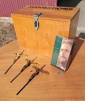 wood suggestion box, three crucifixes, sealed VHS visible