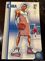 Front of illustrated box showing stylized Allen Iverson art and NBA branding