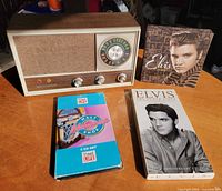 Front view of Lloyd's radio and three CD sets