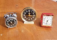 All three alarm clocks side by side