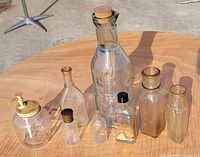 All eight glass containers displayed together on table