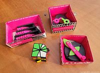 Overview of four logic games in trays on tabletop