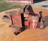 Right side view showing Champion casting, jaw faces, base