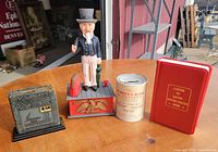 All four coin banks arranged on table