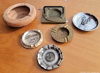 overview of all six ashtrays on table surface
