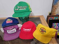 Group shot of all five vintage motorsports caps