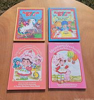 All four books front covers displayed