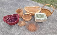 all eight baskets grouped on concrete surface