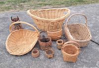 All ten wicker baskets arranged on pavement