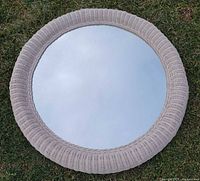 Front view showing wicker frame and mirror glass