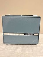 closed projector case showing Bell & Howell Autoload badge