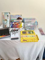 All art supplies arranged on table