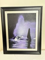 Front view of framed whale artwork