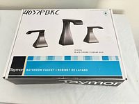 Closed box showing Taymor branding, Dixon model and faucet image