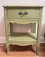 Front view of one bedside table showing drawer, handle, shelf, legs