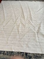 Full view of cream queen blanket