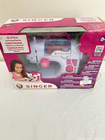 Front of retail box showing Singer EZ Stitch toy sewing machine