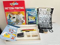 All items grouped: pattern printing kit, paper press kit, stencil pack, stamp kit, stamps and ink pads