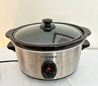 Front view of stainless steel homeMAX slow cooker with glass lid