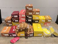 Stacked boxes and bagged wigs on table