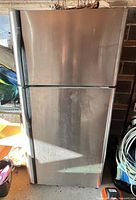 Exterior view showing stainless steel doors and black sides