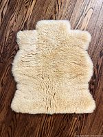 Front view of cream lamb fur throw showing full fur surface