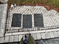 All three rubber mats laid out on driveway for scale