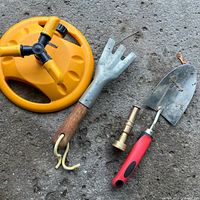 All four garden items on concrete surface