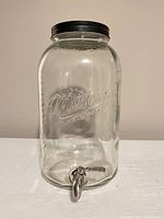Full view of glass Mason Craft & More dispenser with lid and spigot