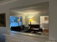Full view of large rectangular mirror mounted on wall