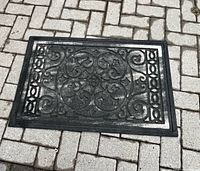 Full view of black rubber mat on stone surface