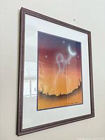 Frontal view of framed print showing artwork, matting and frame