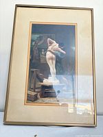 Full view of framed print with mat and frame visible