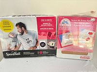 Speedball screen printing kit box and Plaid screen holder box