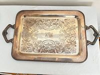 Top view of silver-plated tray showing engraving and handles