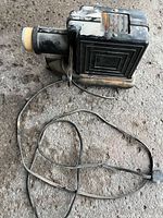 Full view of projector with cord