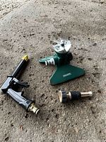 Sprinkler, spray gun nozzle and connector on ground