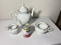 Teapot, sugar bowl with lid, creamer beside size reference can