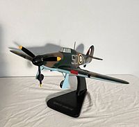 Port front view of wooden Hawker Hurricane model on stand