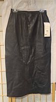 Front view of black leather skirt with tag attached