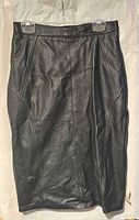 Full front view of black leather skirt showing style and condition