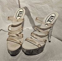 Front angled view showing clear straps, platform and overall design