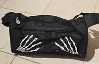 Side view showing skeleton hand graphics and overall shape