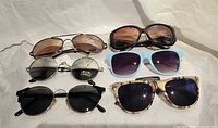All six pairs of sunglasses laid out for overview