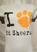 Front view of T-shirt showing full graphic and text