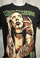 Full front view showing Marilyn Manson artwork and logo