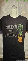 Front view of black Cheech and Chong graphic T-shirt on mannequin